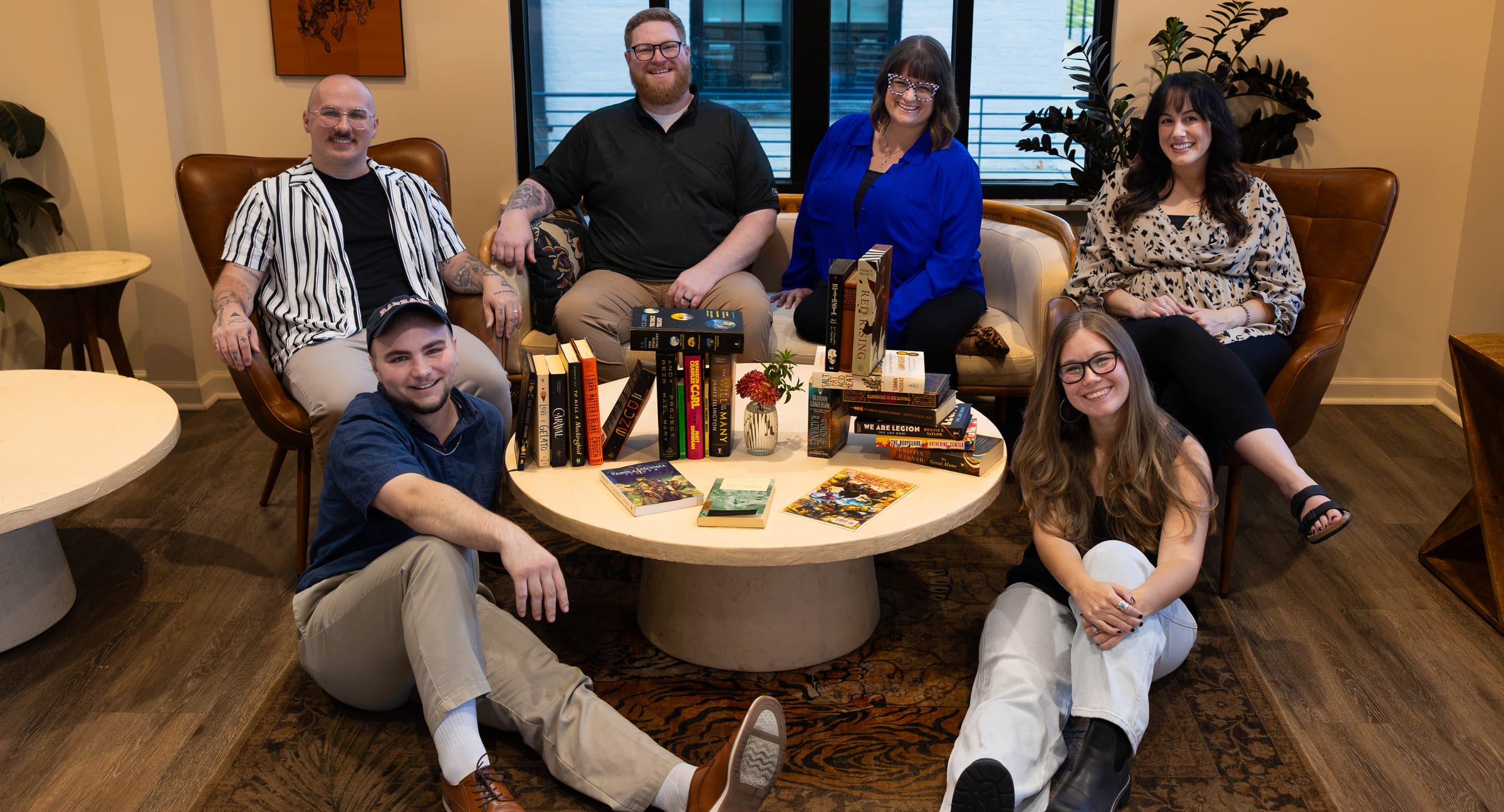 The Lion Publishing team gathered around a table covered in their favorite books